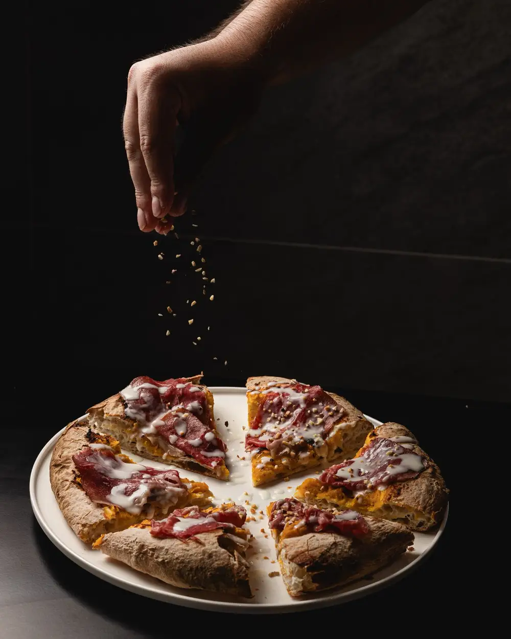 Pizza tonda di Quarantotto con granella